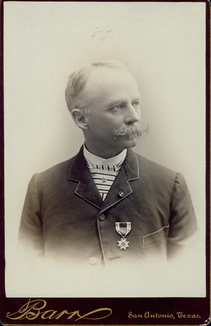 Bust portrait of Hiram L. Kelley, wearing a striped tie and a suit with a medal pinned to the jacket, and with his head turned to the right by San Antonio D.P. Barr