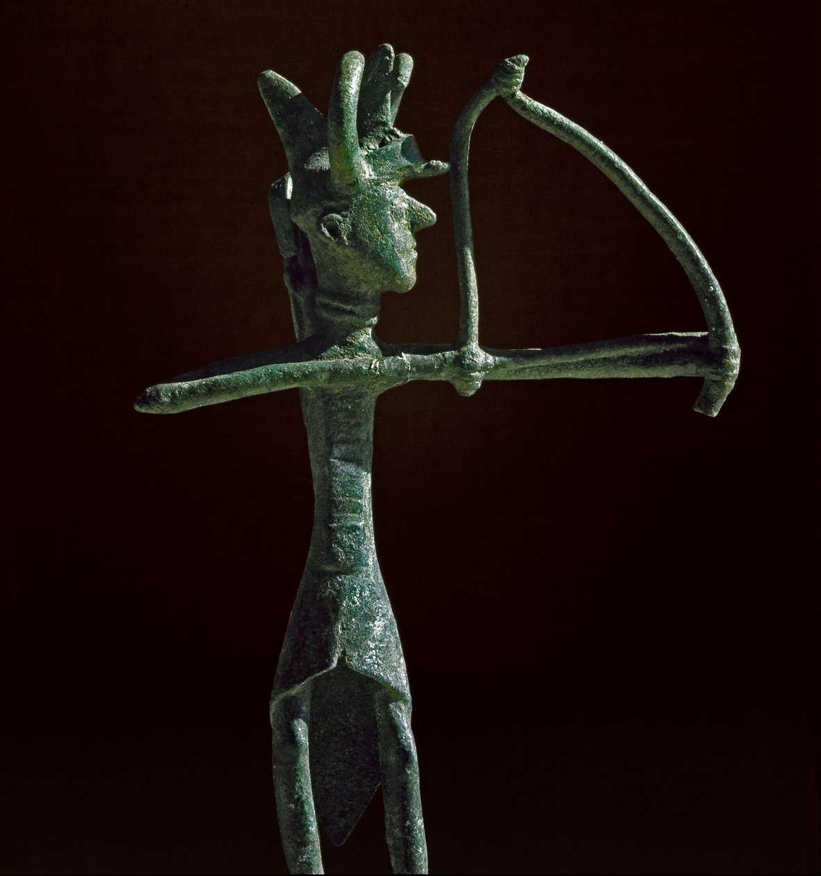 Statuette of warrior pulling a bronze bow. 8th-7th century BC. Museo Nazionale Archeologico, Cagliari, Sardinia, Italy by Sardinia Nuragic Civilization