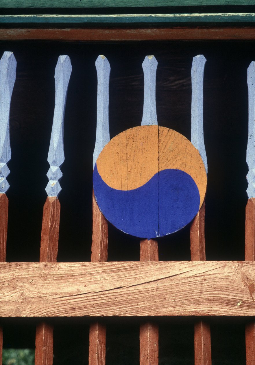 Yin and Yang Symbol on a Wooden Barrier by School Korean