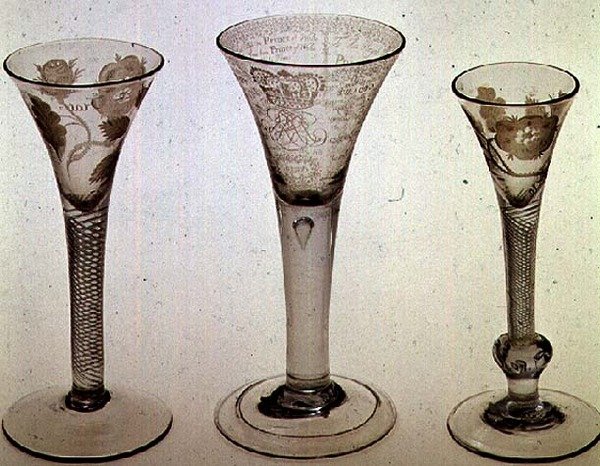 Jacobite glassware: left to right: wine glass with trumpet bowl, 1745; Amen glass, James VIII of Scotland, 1725; Wine glass with trumpet bowl, 1750 by Scottish School