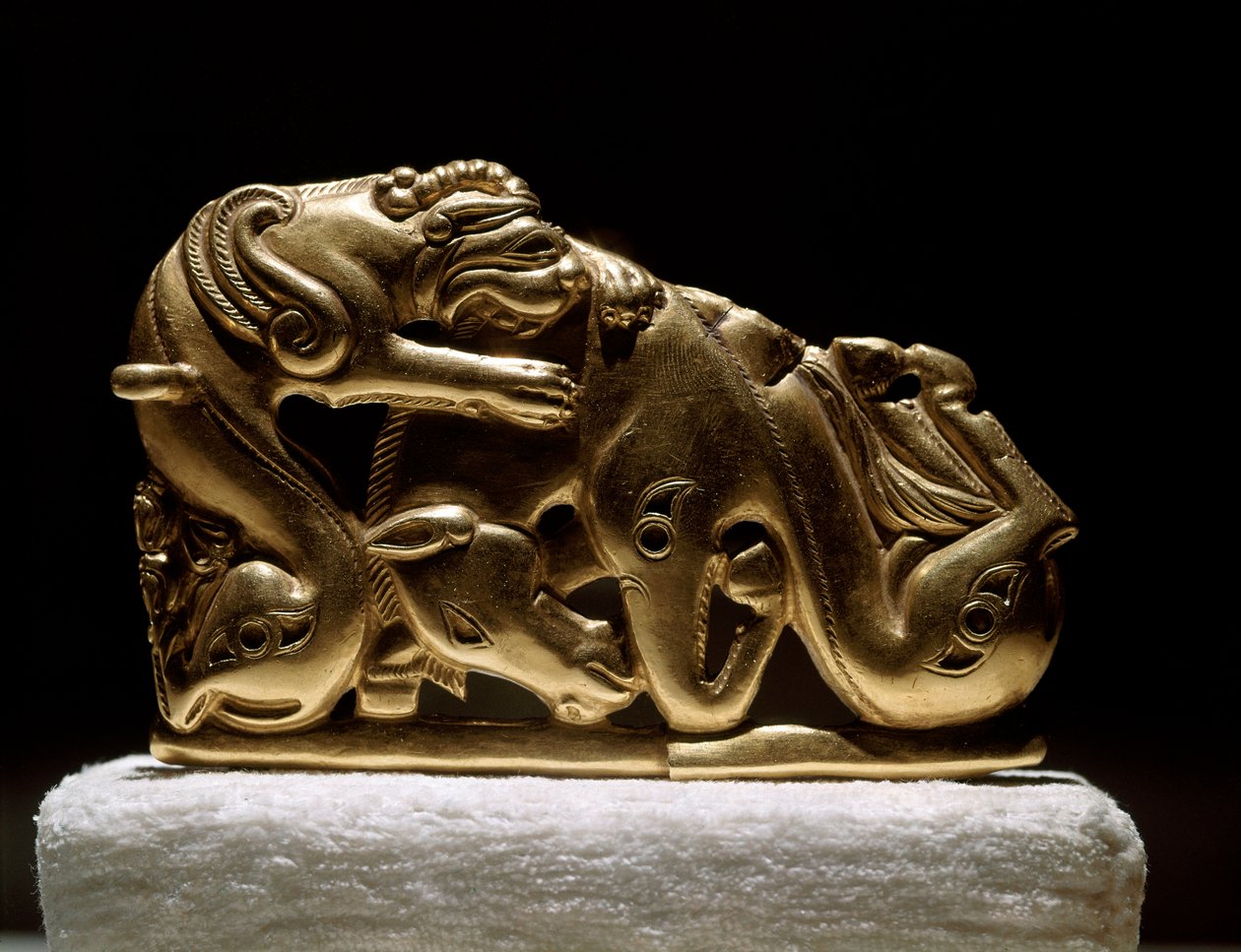 Scythian art: gold belt fibula depicting a griffin attacking a horse ...
