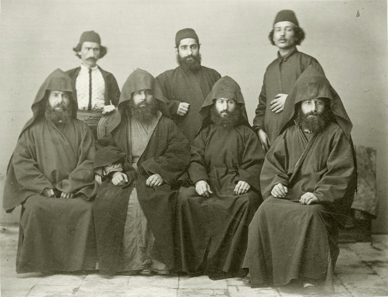 Group of 4 Armenian Priests and 3 Others in the Courtyard at the Mediterranean Hotel, Jerusalem, 1867 by Sergeant Henry Phillips