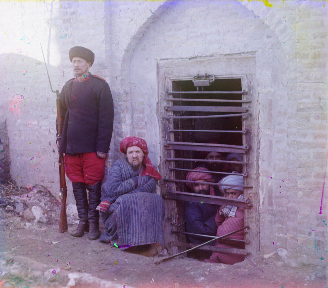 Zindan (traditional Central Asian prison pit) with uniformed guard, probably Bukhara by Sergey Prokudin Gorsky