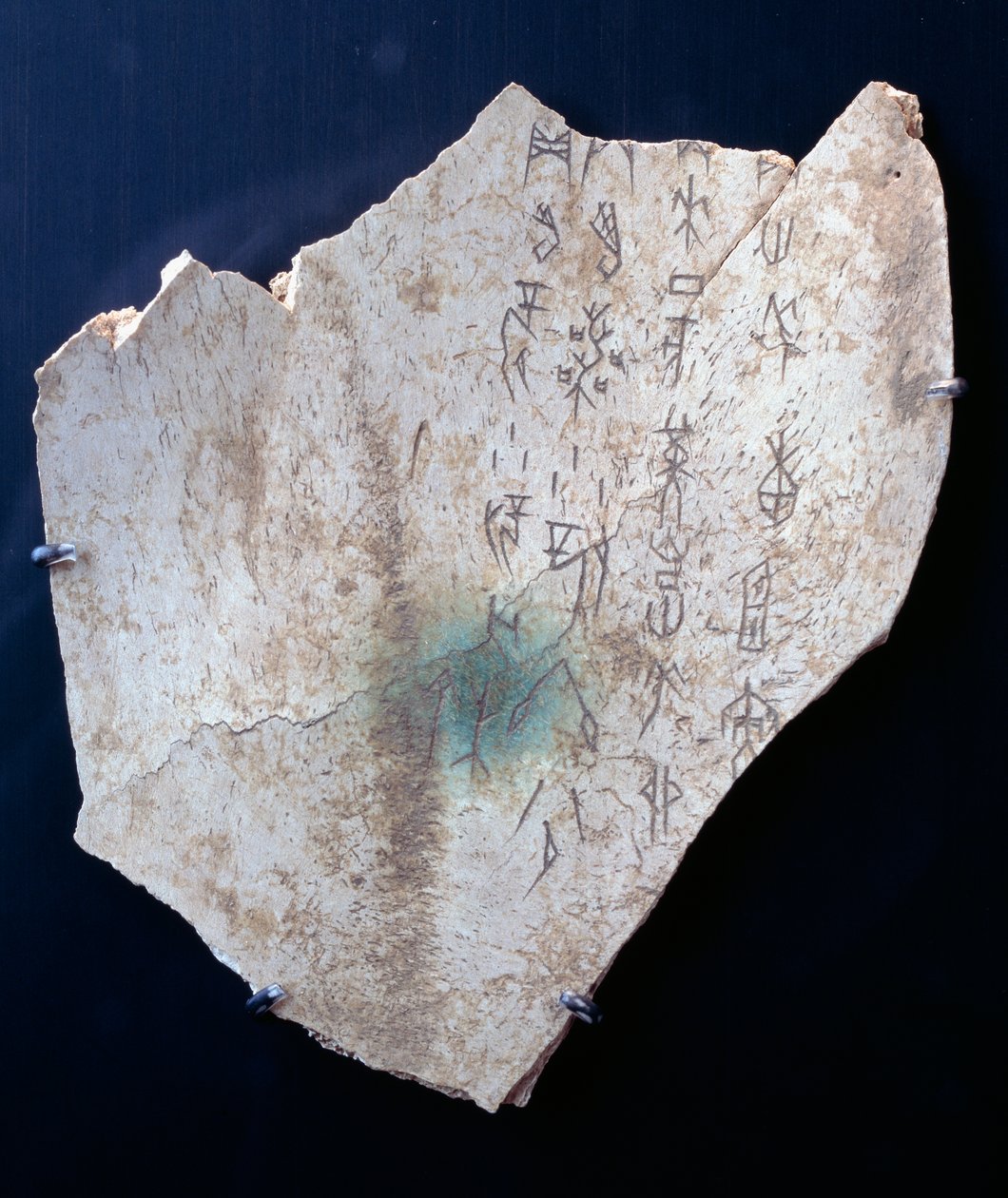 Pictogram on an ox scapula with a ritual to ward off danger by Shang Dynasty Chinese School