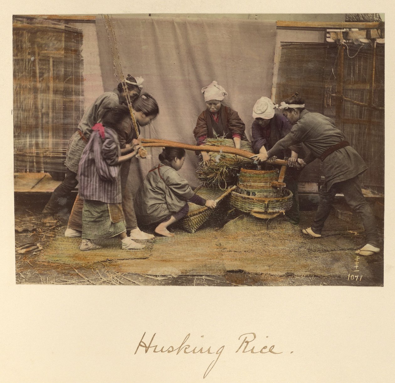 Husking Rice by Shinichi Suzuki