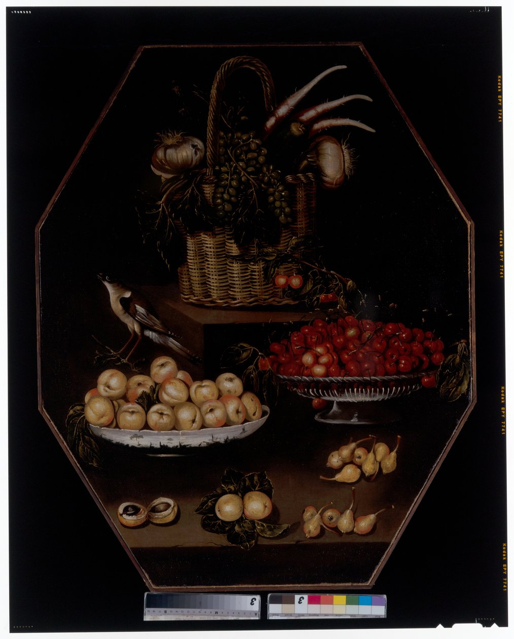 A Still Life with Pomegranates and Grapes in a Basket by Spanish School