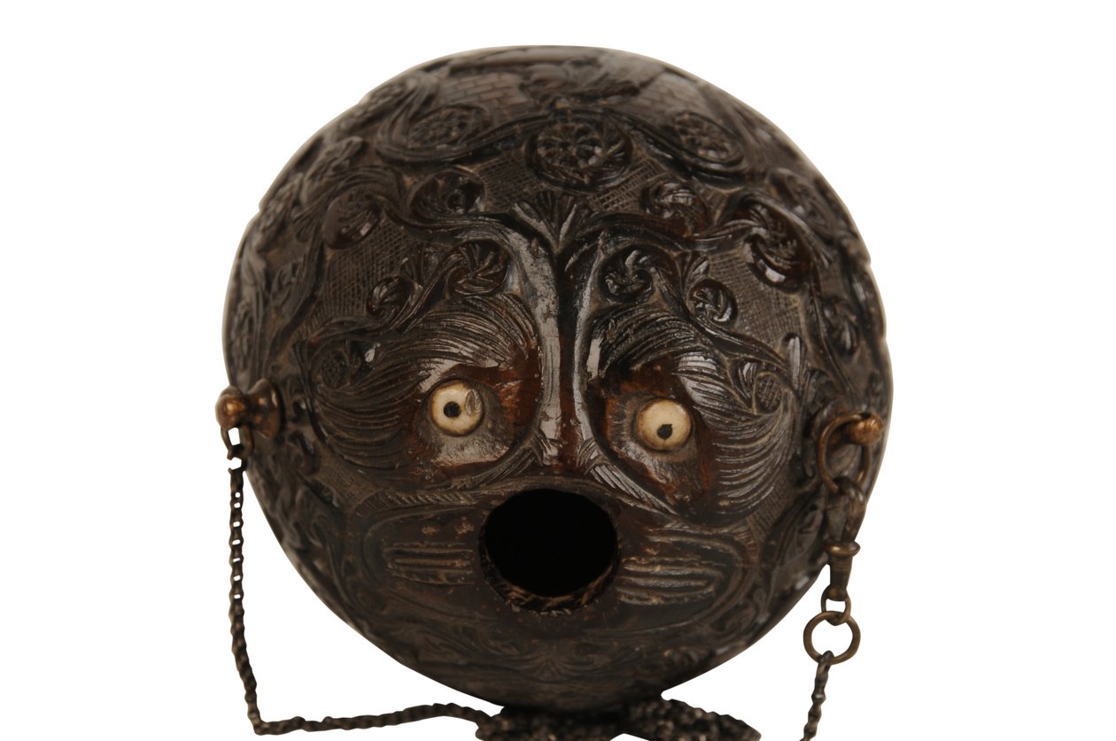 Carved coconut powder flask bugbear, Spanish Colonial, early 19th century by Spanish School