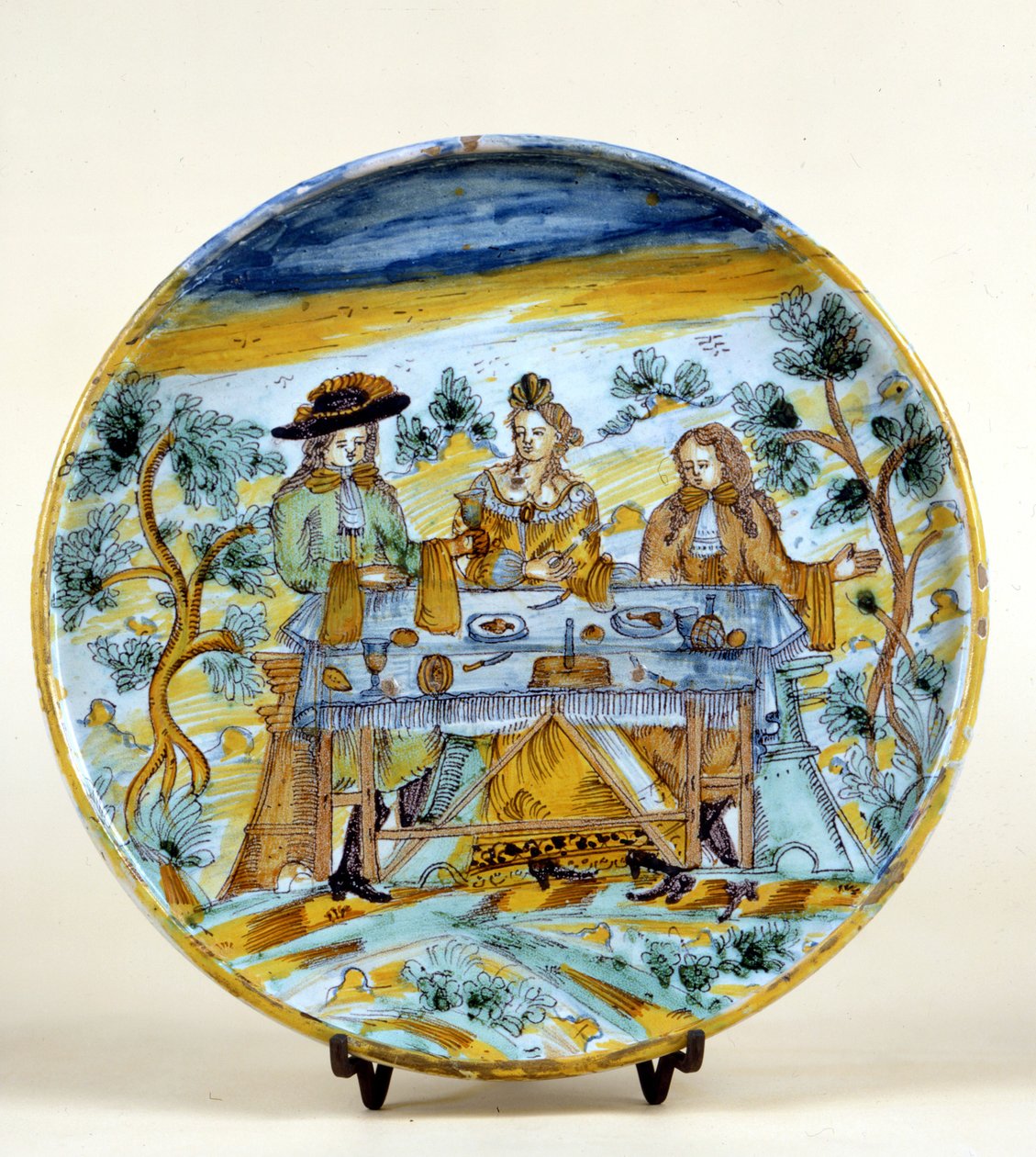 Representation of an outdoor banquet on a ceramic plate of Talavera de la Reina (Spain). Early 16th century. Milan, Museo del Castello. by Spanish School