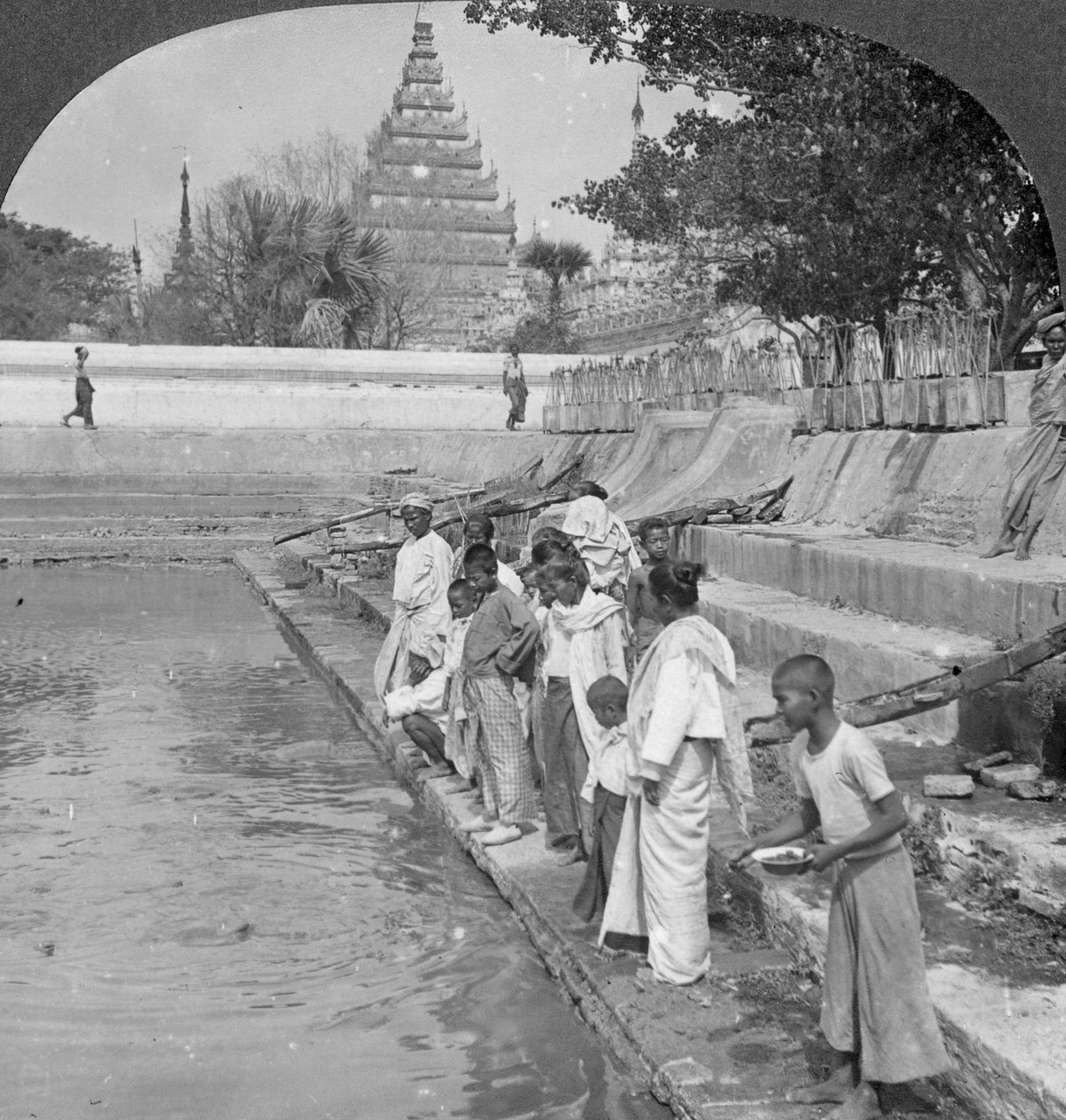 Pilgrims Feeding Holy Turtles, Arakan Pagoda, Mandalay, Burma, 1908 by Stereo Travel Co
