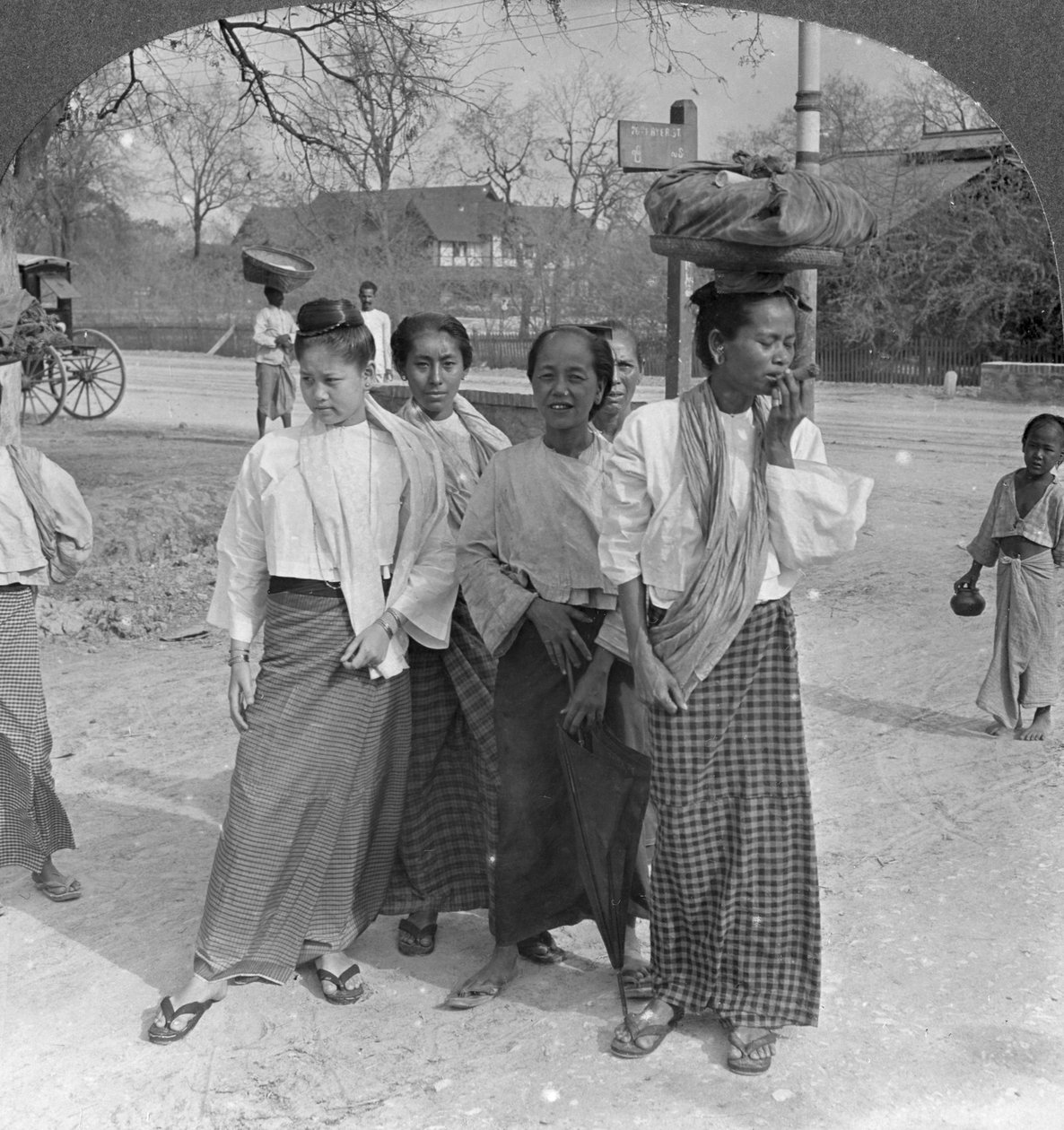 Woman and servants going to a market, Mandalay, Burma by Stereo Travel Co