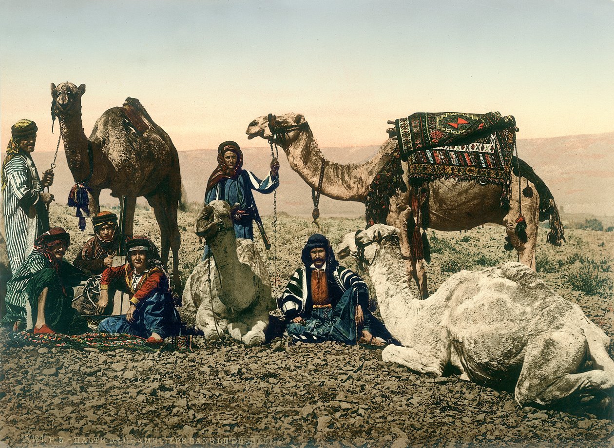 Western travellers dressed as Bedouins and their guides with their camels in the Jordan Valley by Swiss Photographer