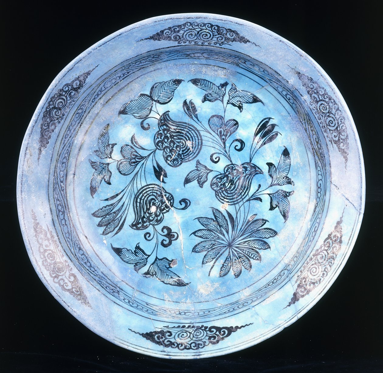 A turquoise glazed dish, with stylised floral spray, 15th century by Syrian School