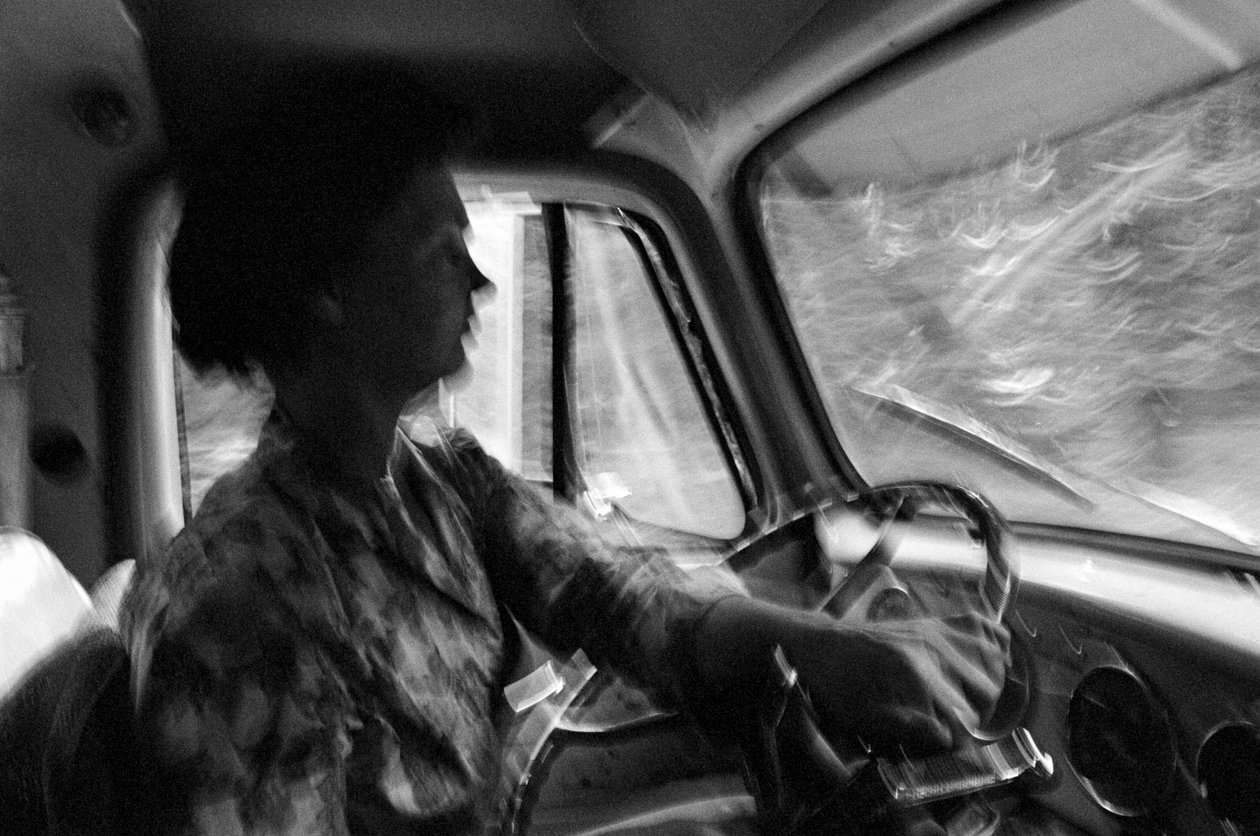 Mildred Cooper, a 43-year-old grandmother, is a truck driver with a logging truck by Ted Spiegel