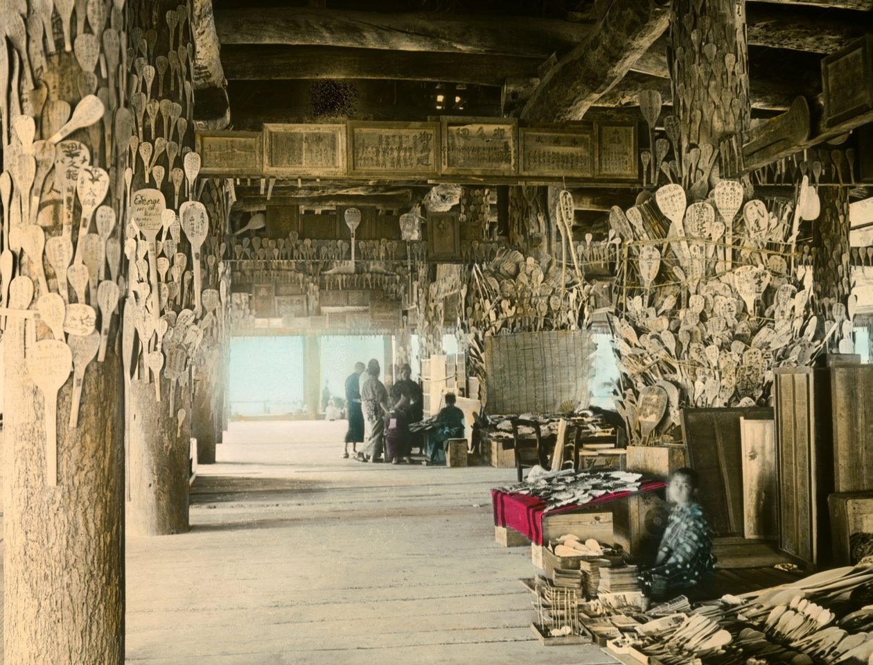 Rice Spoon Vendor in the Thousand Tatami Pavilion, Miyajima, circa 1900 - 1915 by Teijiro Takagi