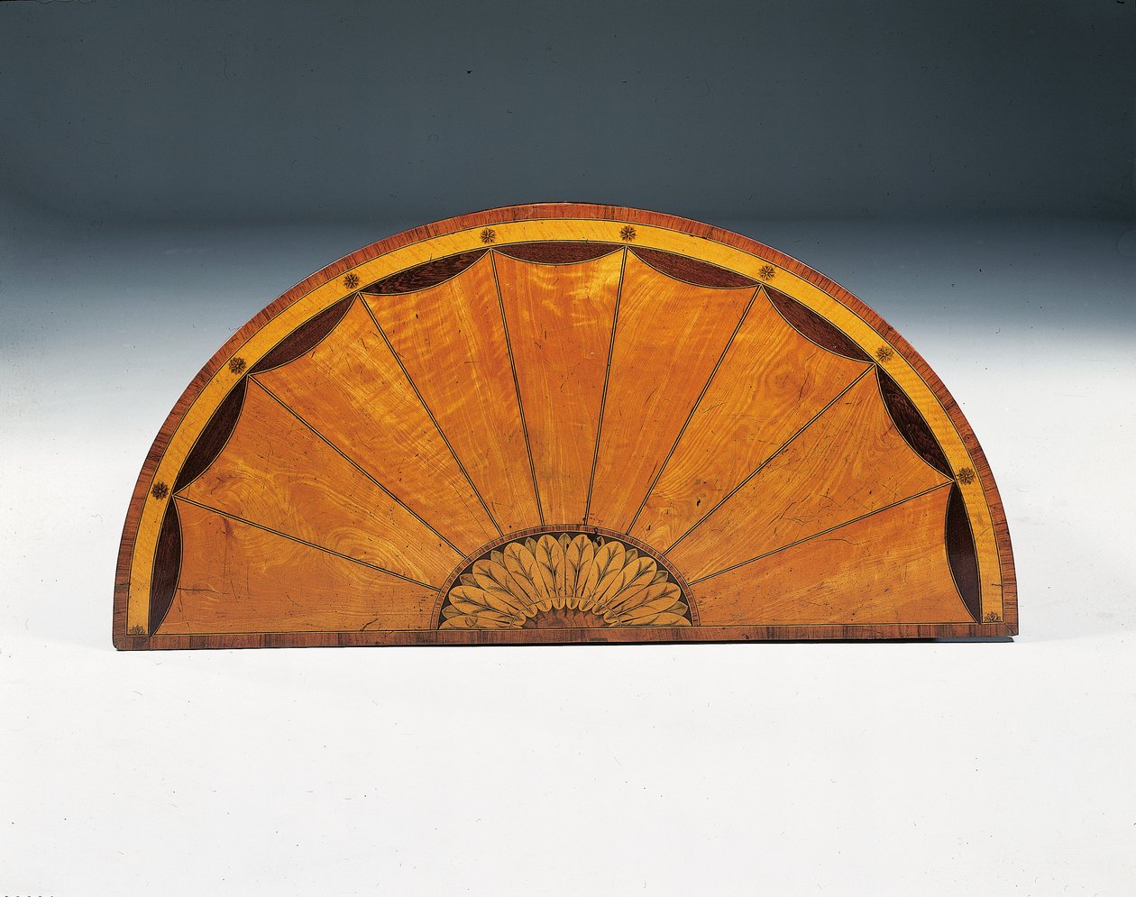 George III marquetry demi-lune commode, c.1760-79 by Thomas (attr.to) Chippendale