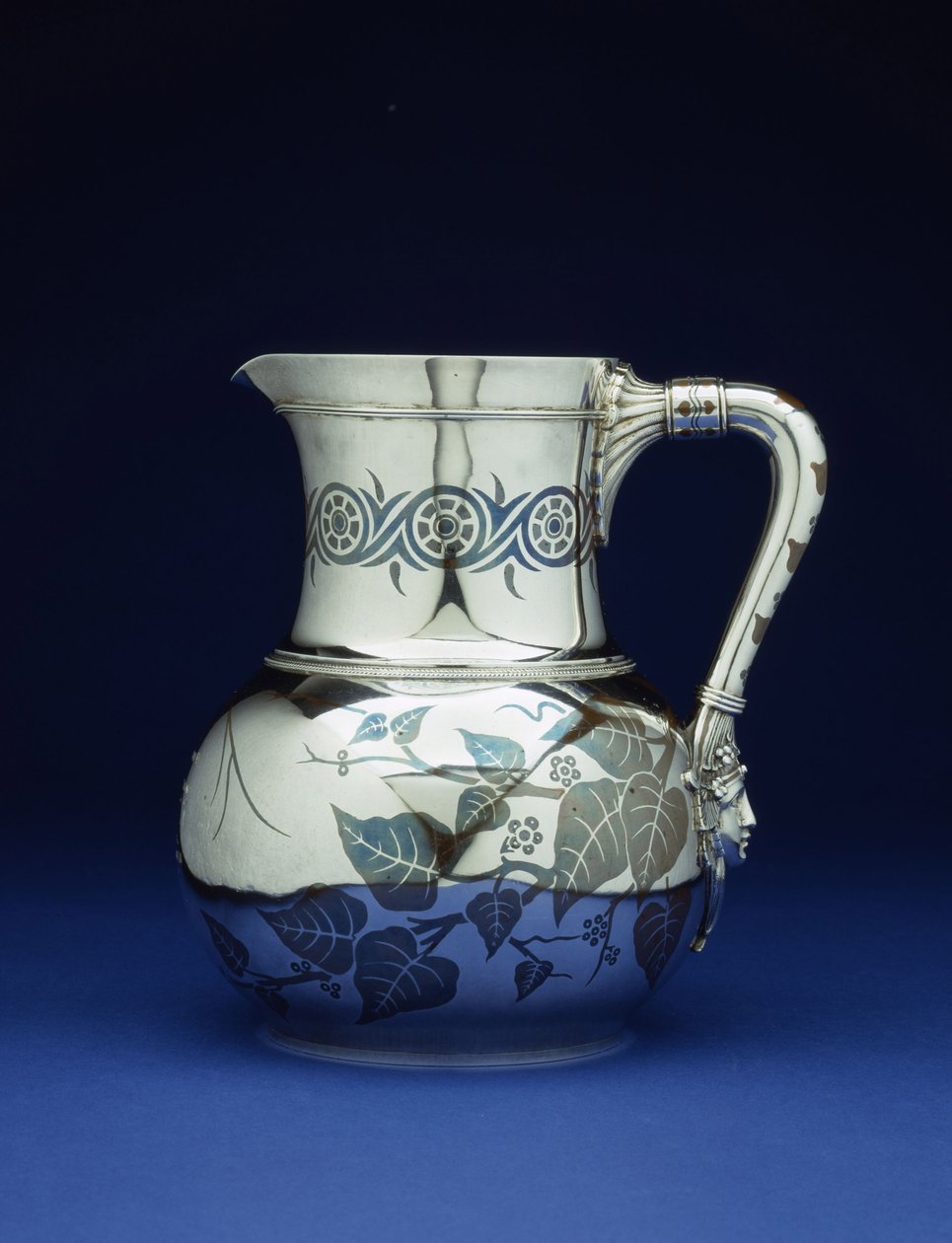 A mixed metal pitcher by Tiffany & Co, New York, c.1877 by Tiffany and Company