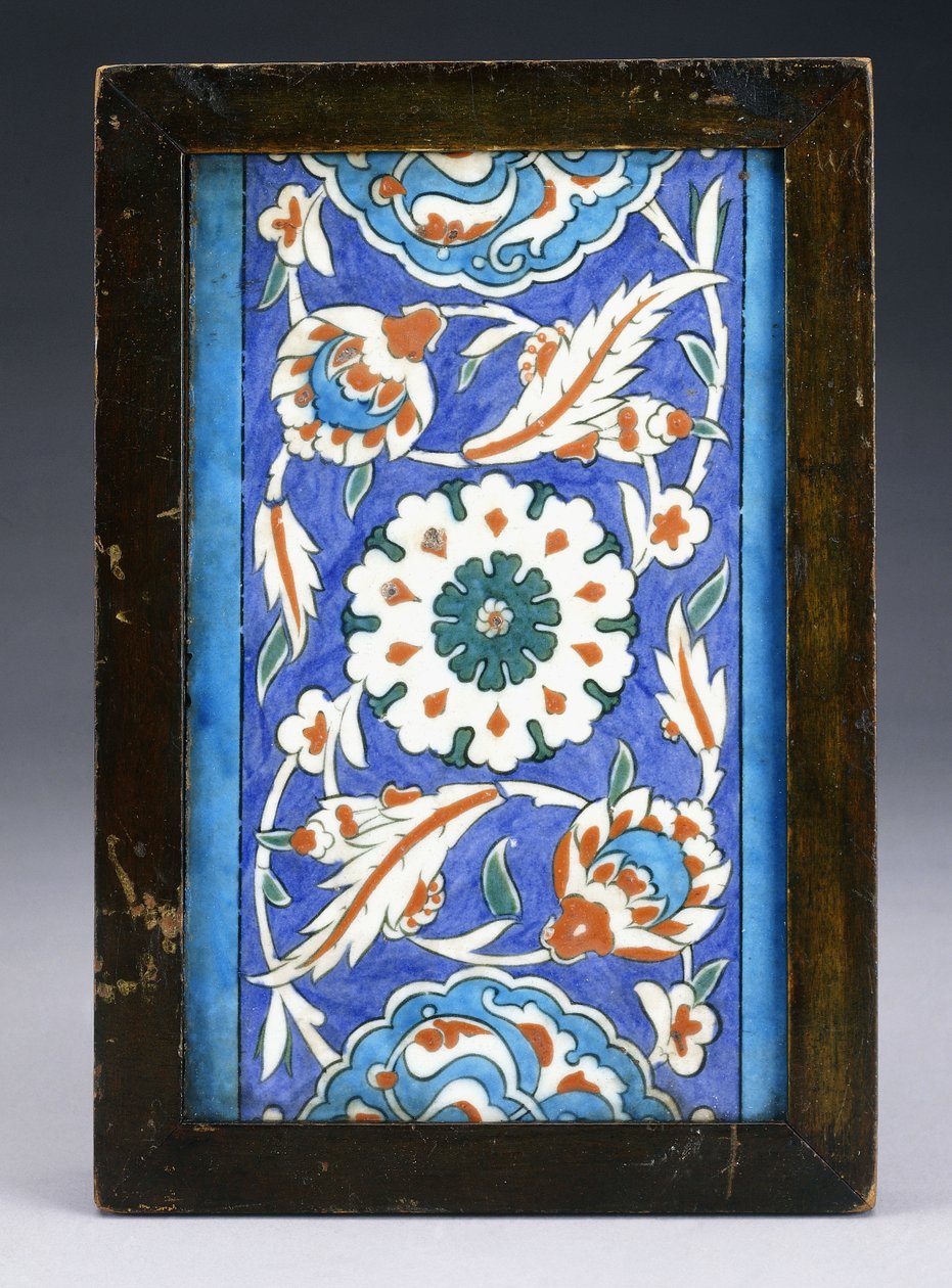 An Iznik Border Tile, with a Central Flowerhead between Scrolling Palmette and Leafy Vine by Turkish School