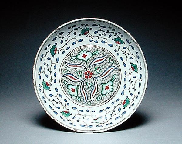 Dish decorated with stylised flowers, Isnik, late 16th century by Turkish School