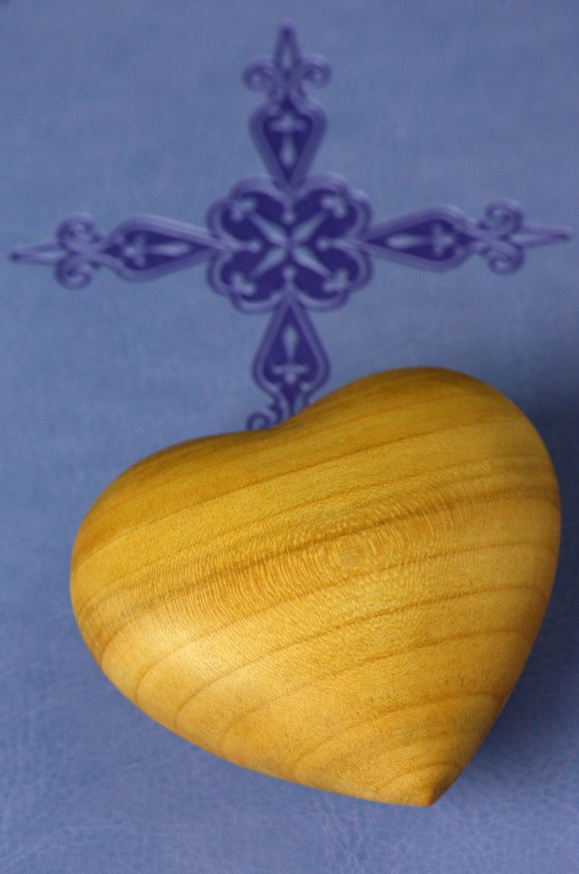 Carved Wood Heart on a Holy Bible by Unbekannt
