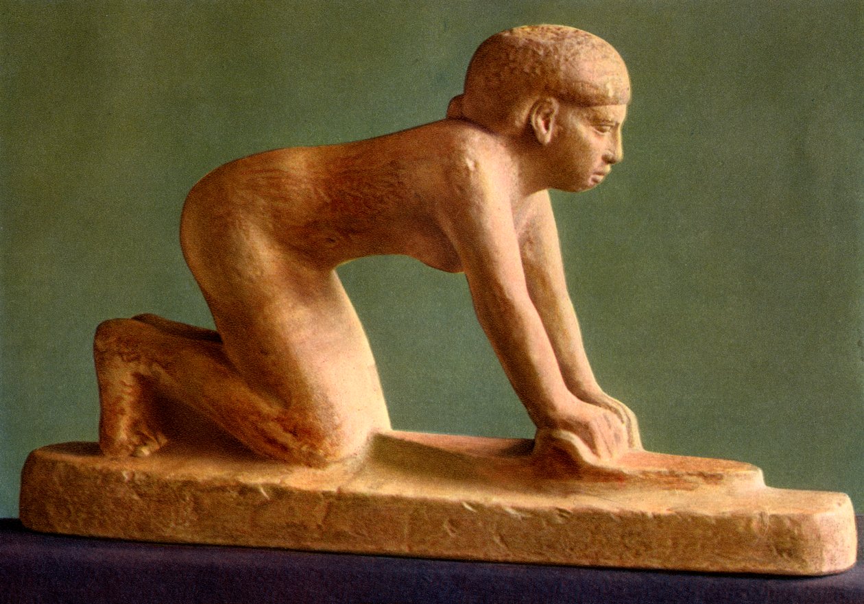 A woman grinding corn by Unbekannt