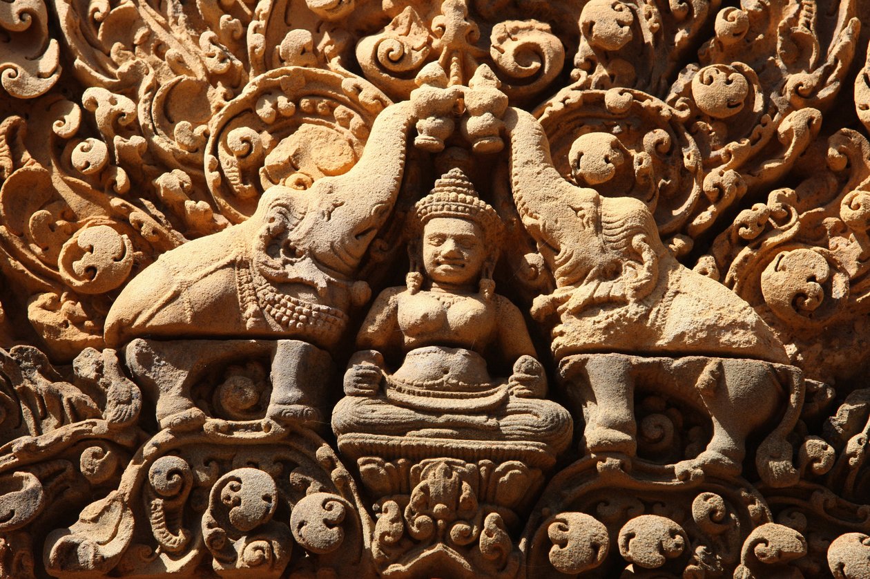 Banteay Srei Temple at Angkor in Cambodia. Lakshmi, Hindu goddess of wealth and wife of god Vishnu, is sprinkled with holy water by two elephants by Unbekannt