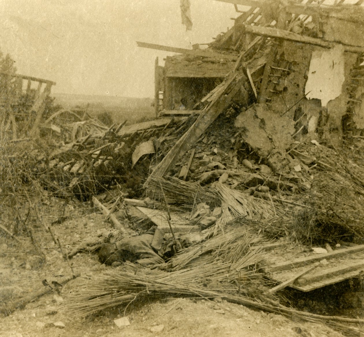 Bombed out building, body of dead soldier in foreground by Unbekannt