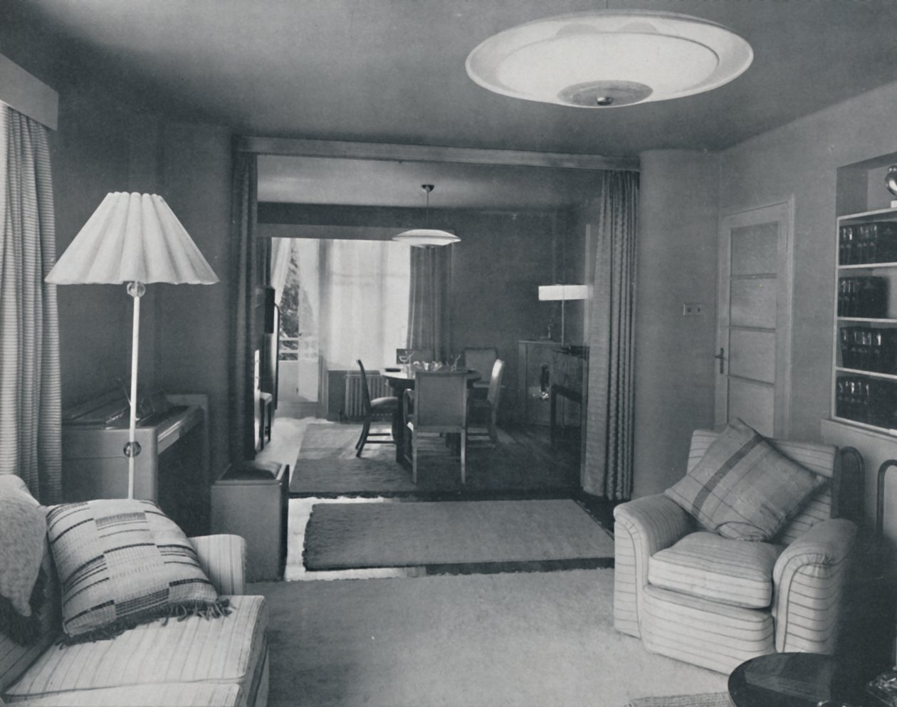 Dining and Living Room, Divided Only by Heavy Curtains in an Attractive Modern Weave by Unbekannt