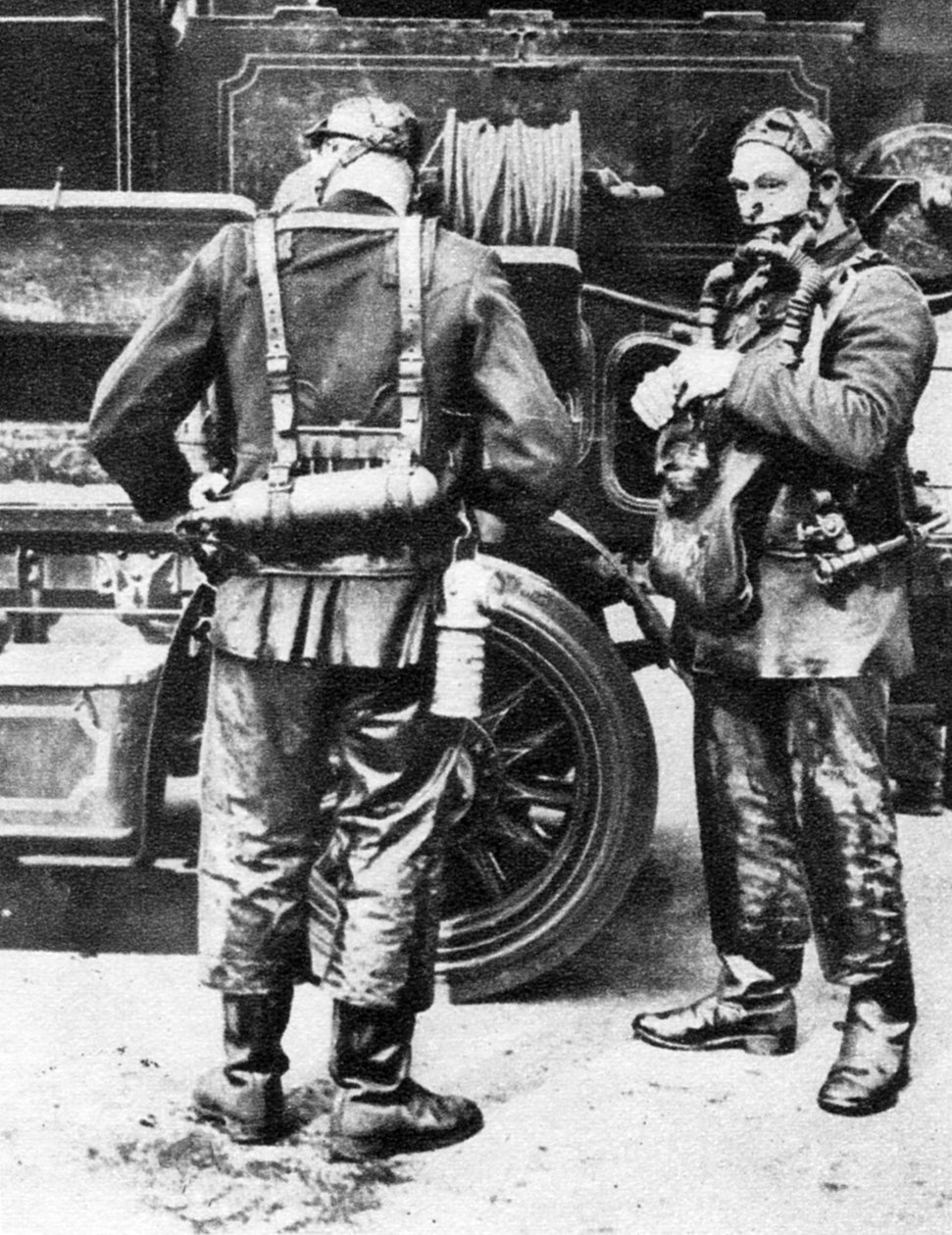 Firefighters donning smoke helmets, Farringdon Street rubber works, London by Unbekannt