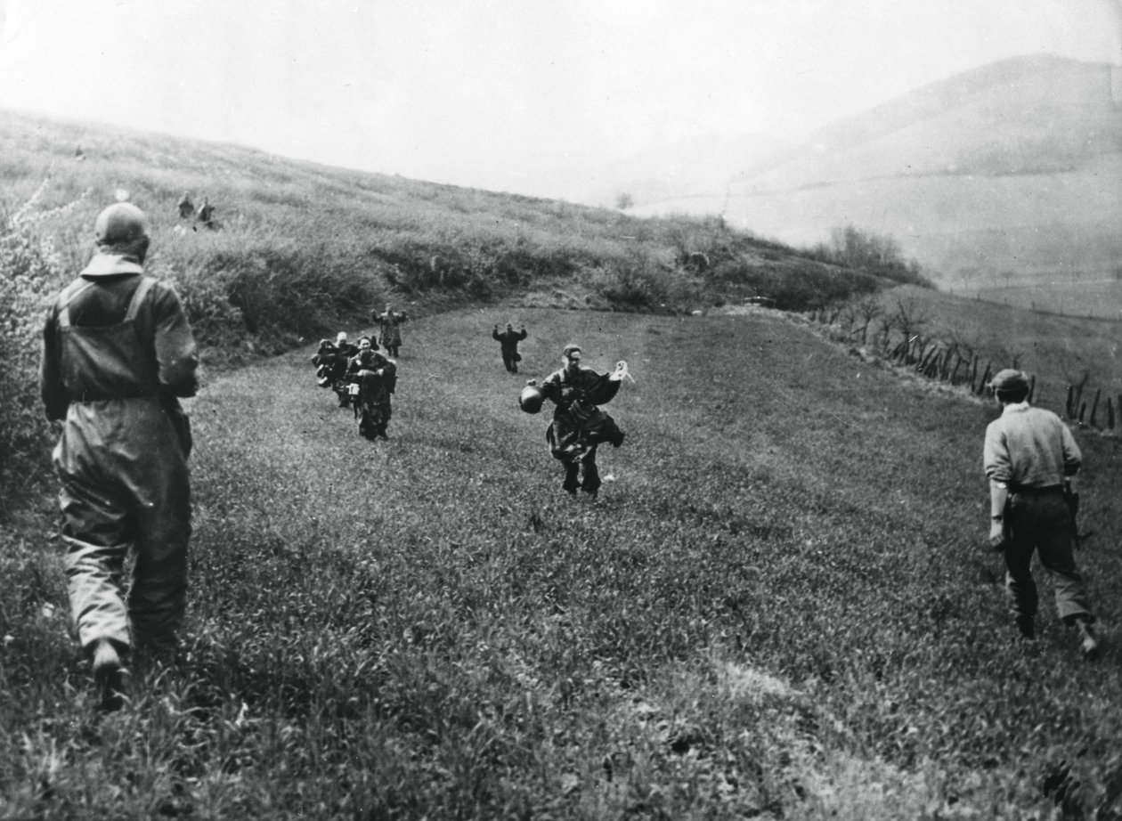 German troops surrendering to soldiers of the American 1st Army, near Elsborn, Germany, April 1945 by Unbekannt