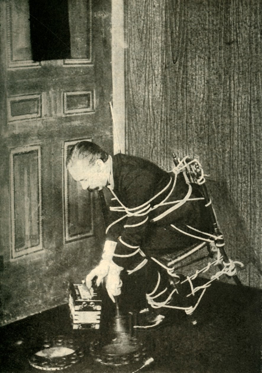 John Nevil Maskelyne Performs a Spirit Cabinet Illusion by Unbekannt