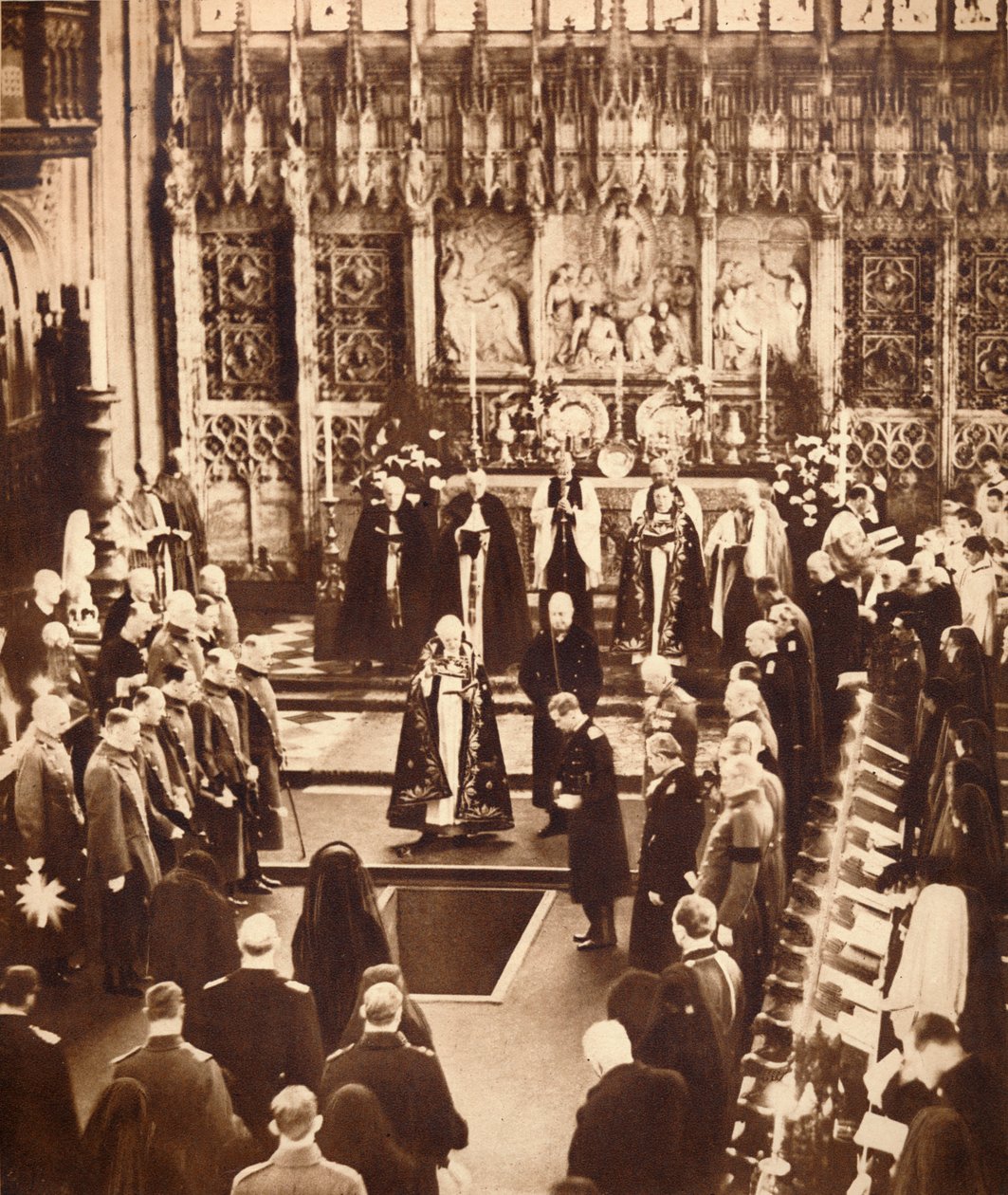 King Edward VIII sprinkles earth on his father