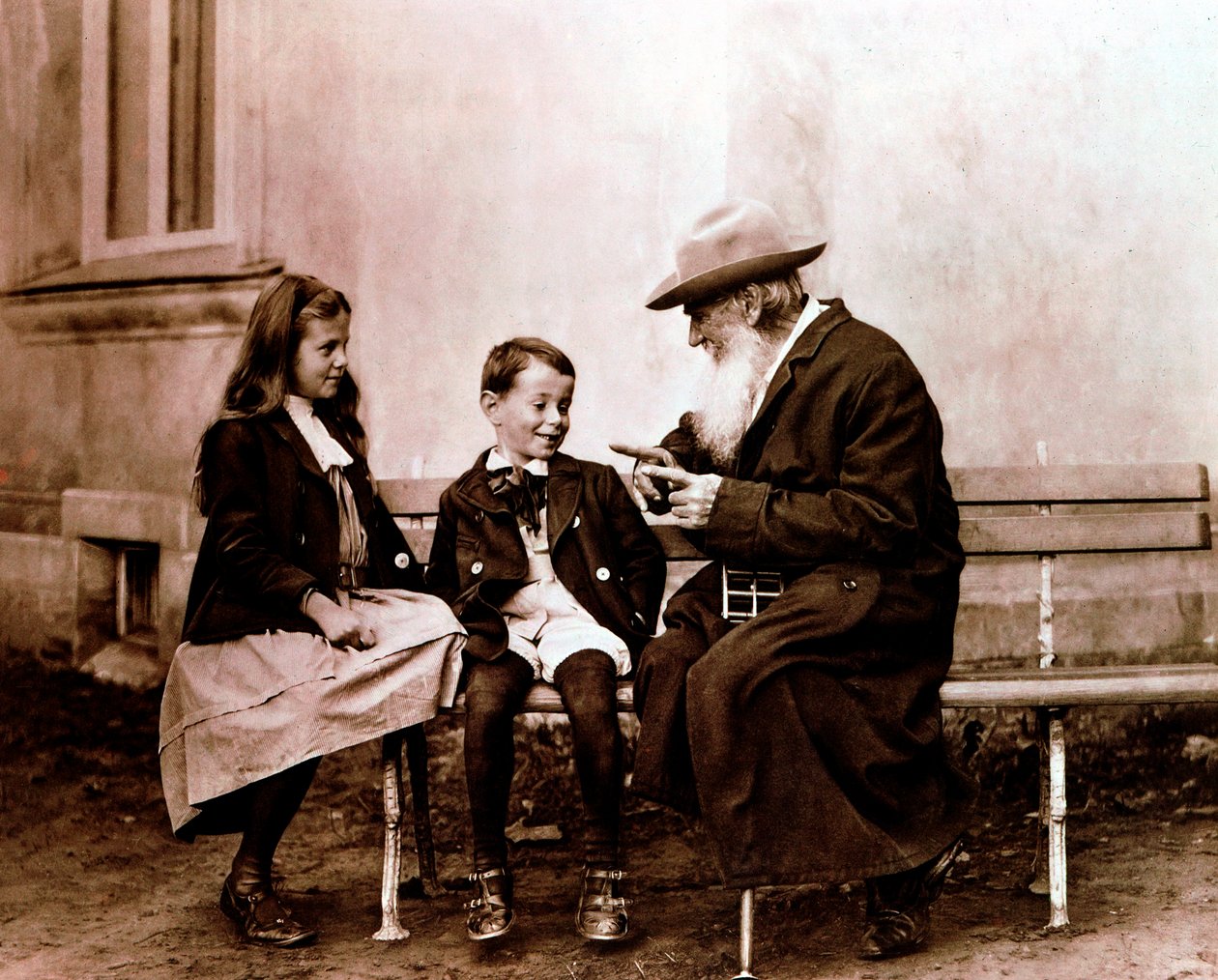 Leo Tolstoy telling his grandchildren a story, c. 1890-1910 by Unbekannt