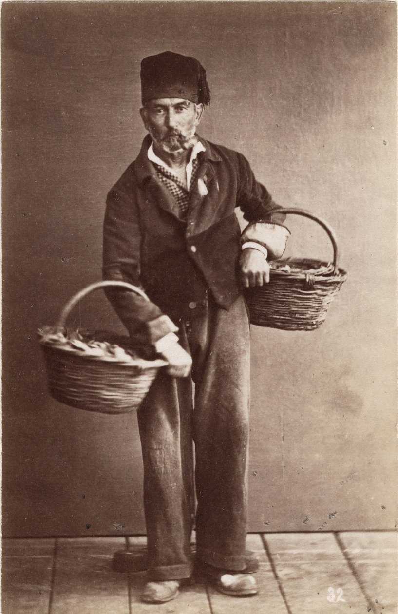 Small metiers: portrait of a fish monger, baskets loads of fish by Unbekannt
