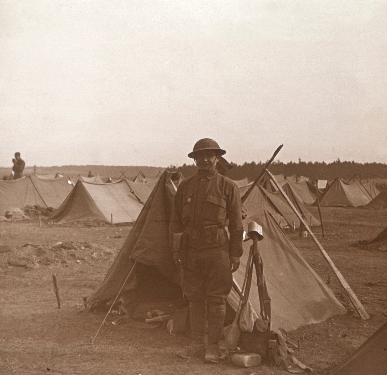 Soldier standing by tent, American camp, Melette, France by Unbekannt