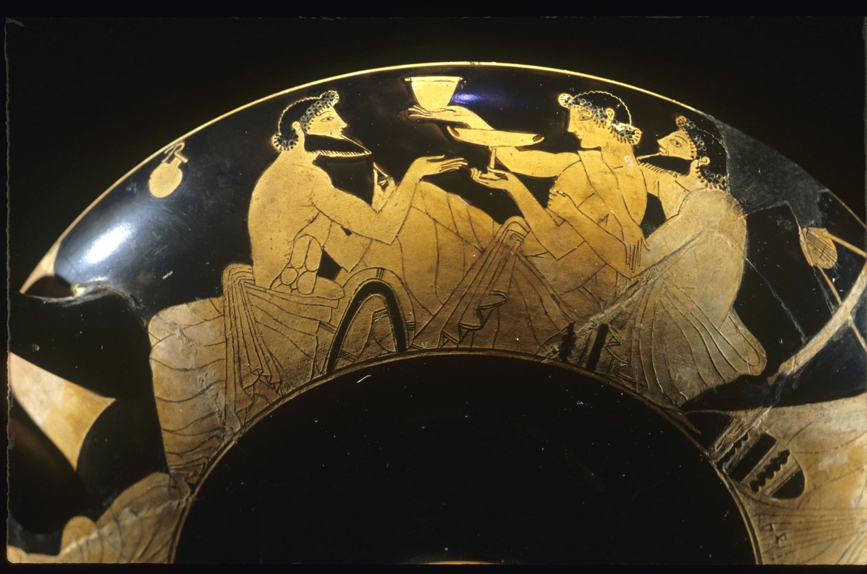 Symposium scene on red figure Attic kylix, wine cup, 5th century BC. by Unbekannt