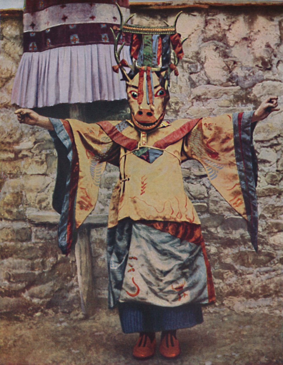 Tibetan lama attired for the devil dance by Unbekannt