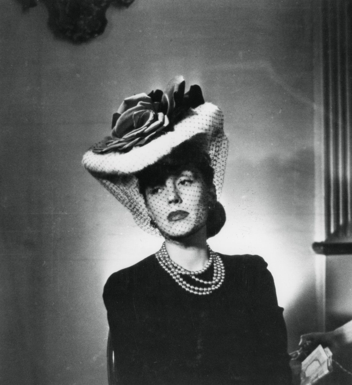 Woman Wearing a Hat and Veil by the French Fashion Designer Jacques Fath by Unbekannt