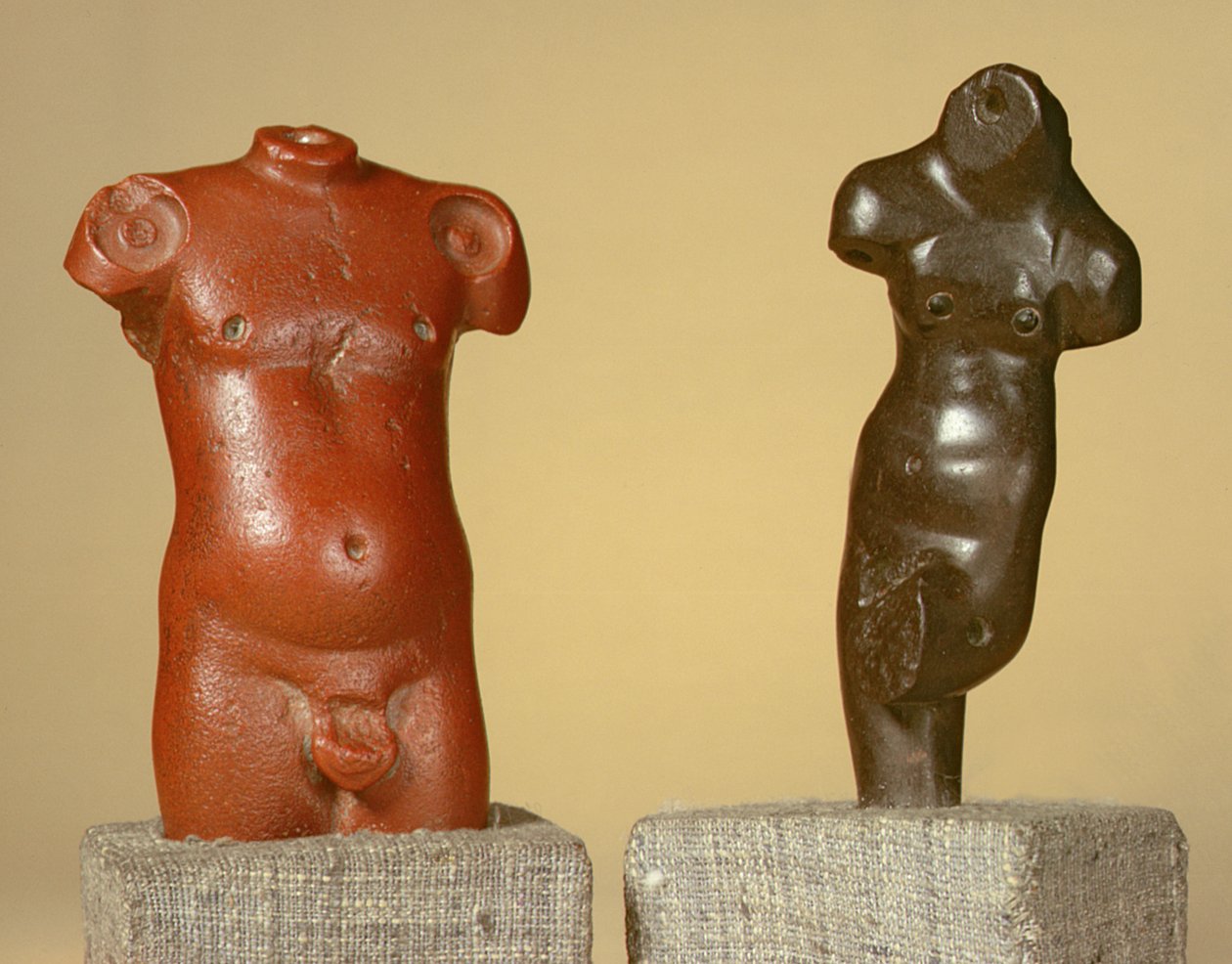 Red sandstone male torso and grey sandstone dancer, Harappa, 2300