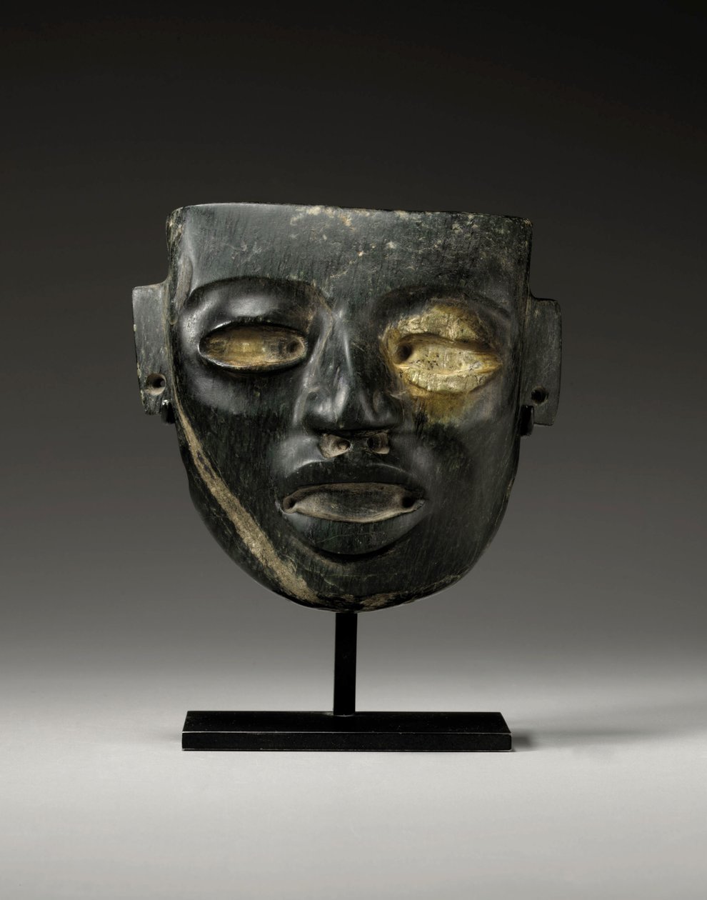 A Teotihuacan stone mask, carved with the youthful face of a dignitary, c.450-650 by Unbekannt