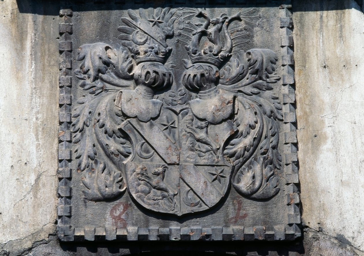 Coat of arms on wooden door of home in Lavis, Trento, Trentino-Alto Adige, Italy by Benjamin Baud
