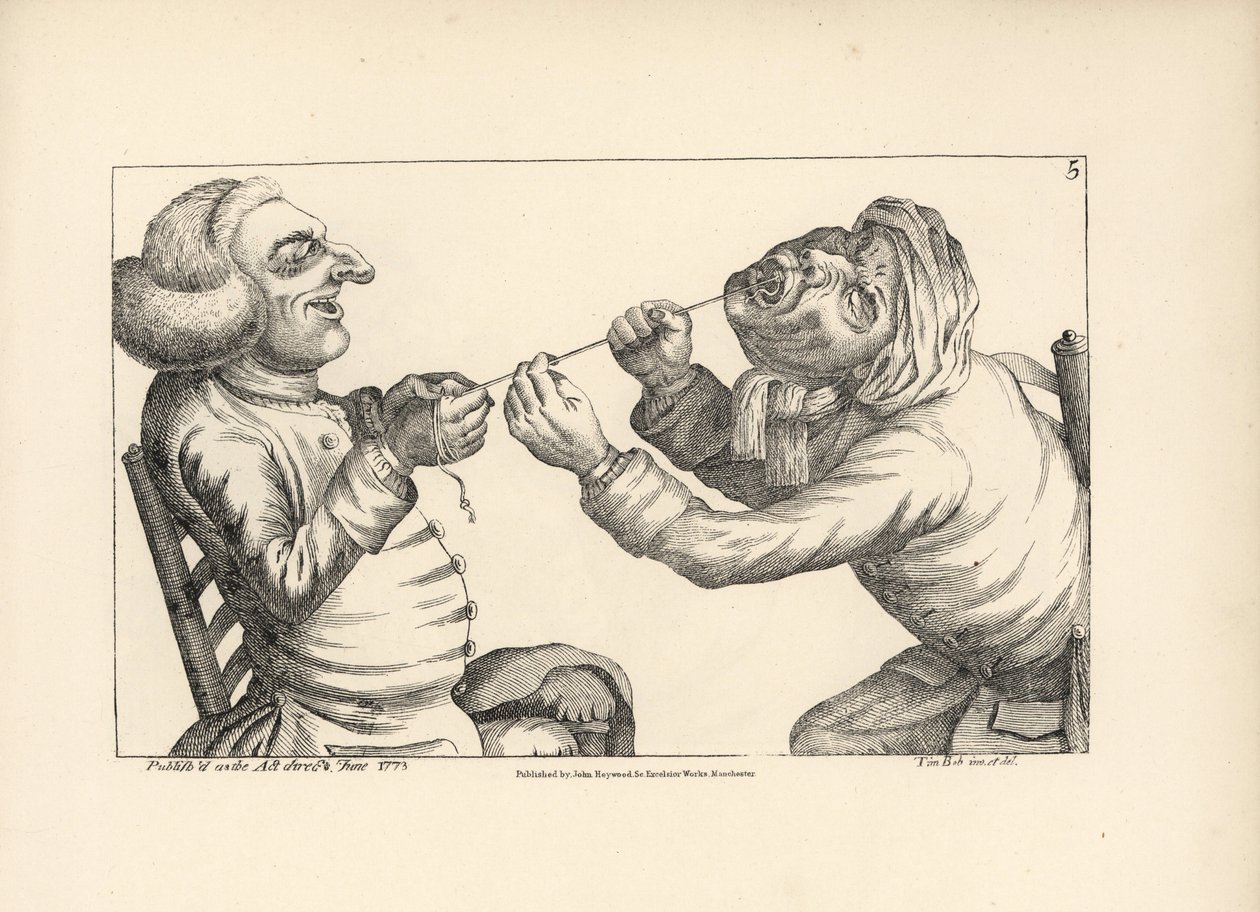 Physician laughing as he pulls a patient
