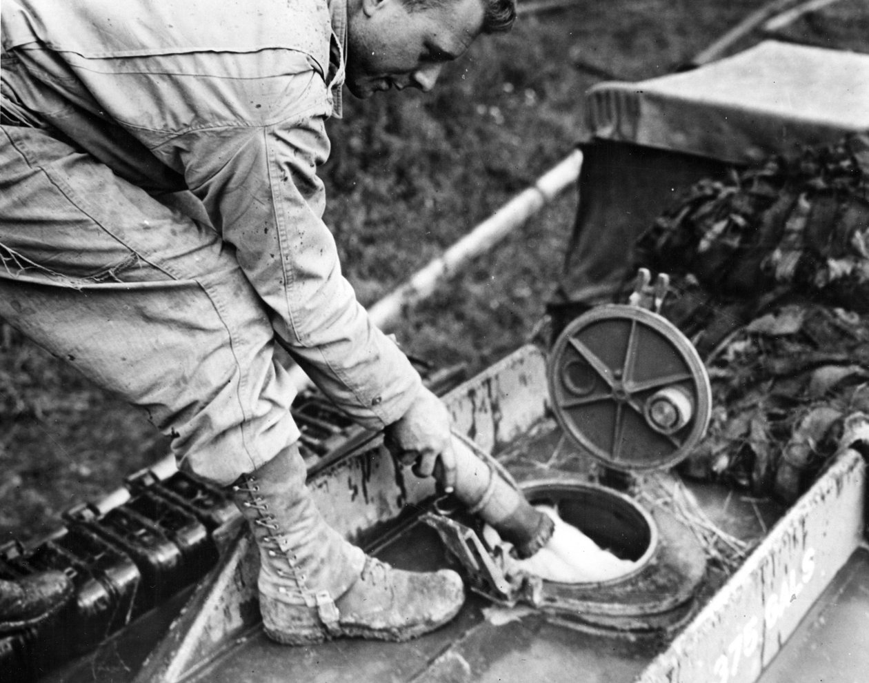 World War II: Normandy (France) Summer 1944: At a gas storage station, a soldier of a US transport company refuels a GMC tanker by Unbekannt