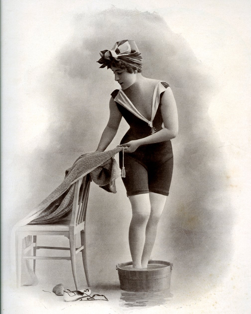 Young woman in a swimsuit taking a foot bath, around 1900 by Unbekannter Künstler