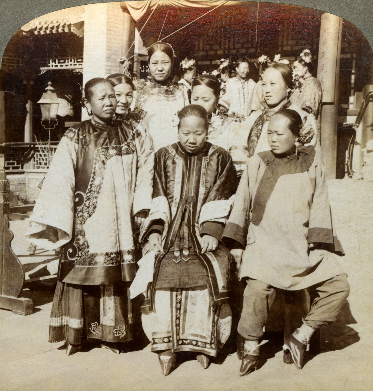A group of women in the courtyard of a wealthy Chinese house, Peking, China, 1902 by Underwood and Underwood