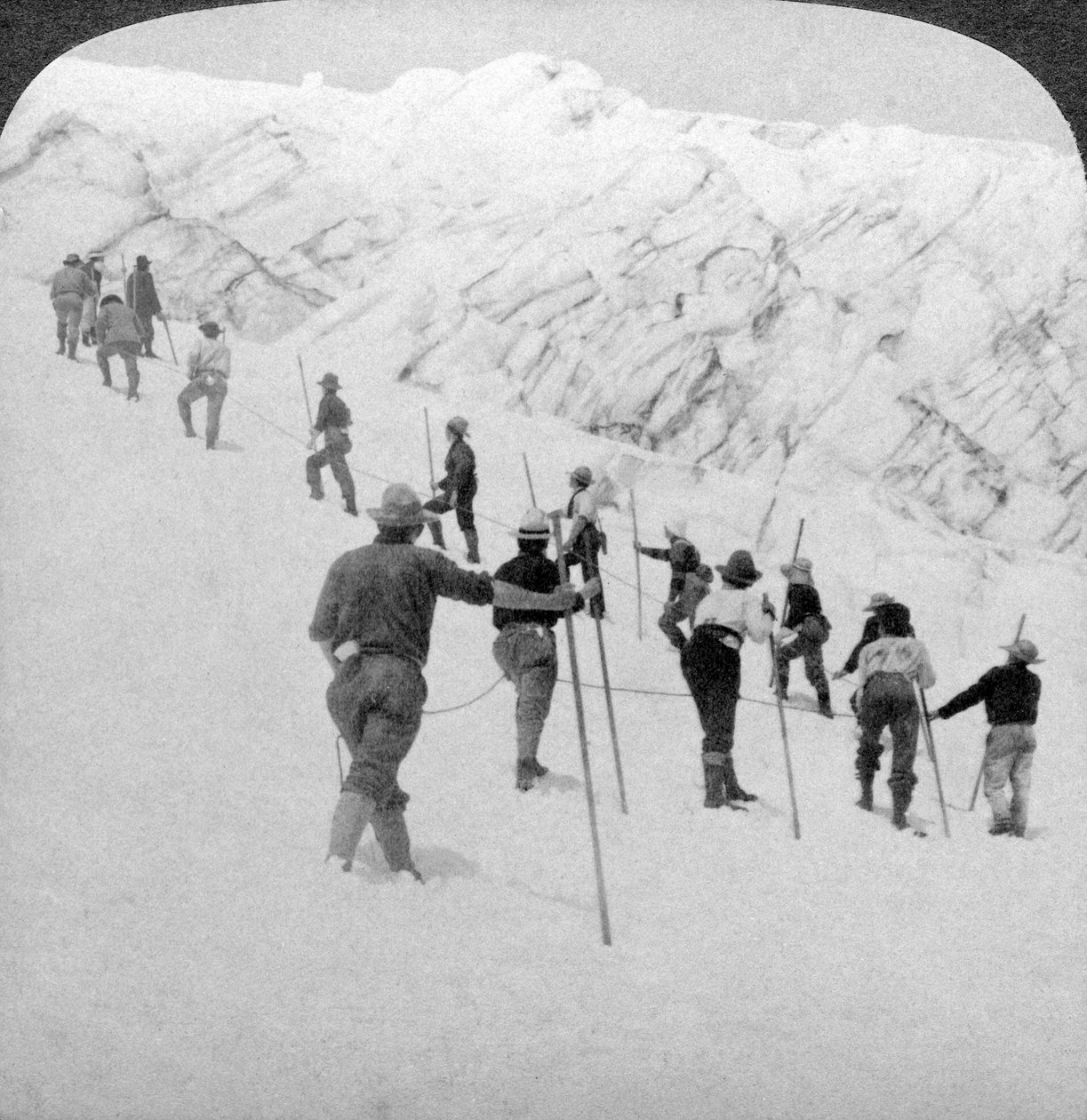 Ascending a steep snowfield, Stevens Glacier, Mount Rainier, Washington, USA by Underwood and Underwood