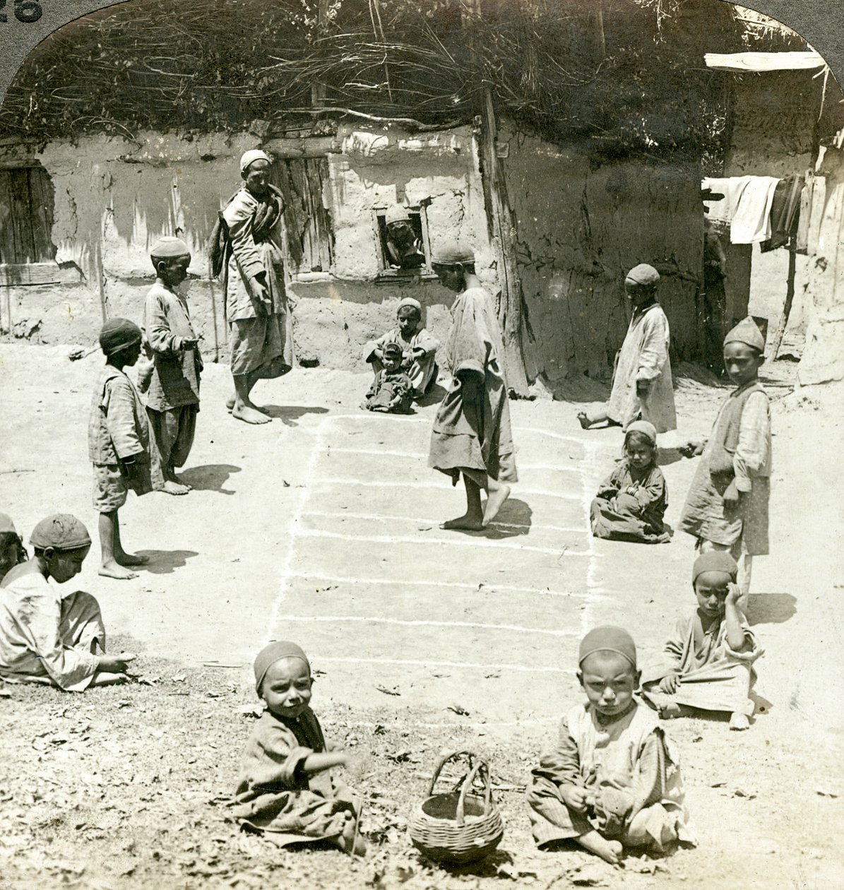 Children playing hopscotch, Kashmir, India by Underwood and Underwood