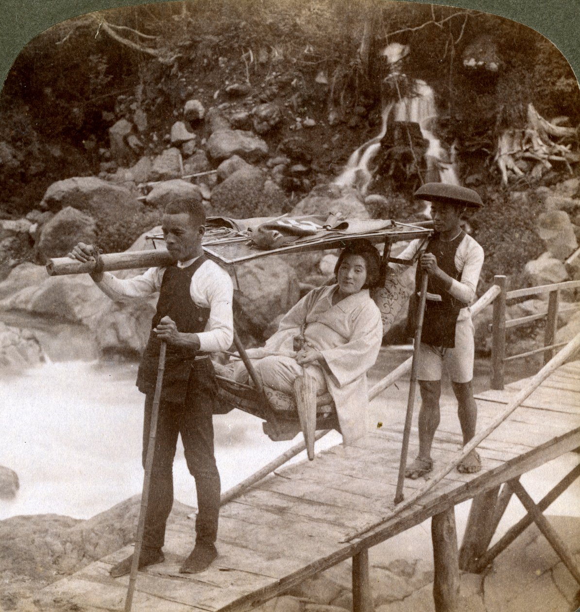 Japanese woman in a yamakago mountain chair crossing the torrential Daiya river near Nikko, Japan by Underwood and Underwood