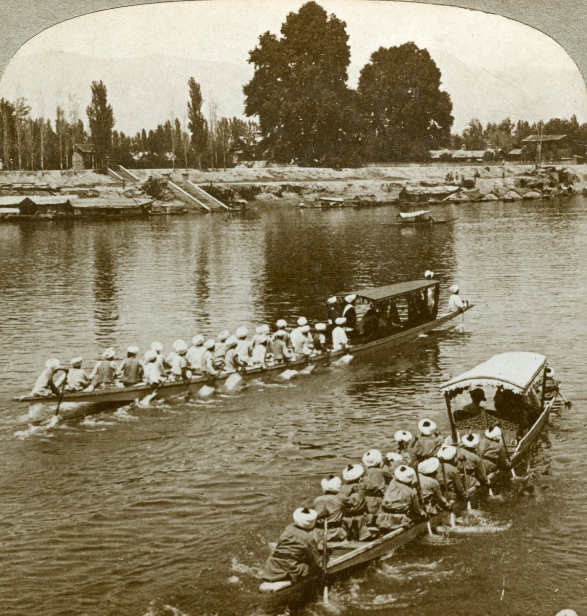 Lady Curzon travelling on the state barge of the Maharaja, Kashmir, India by Underwood and Underwood