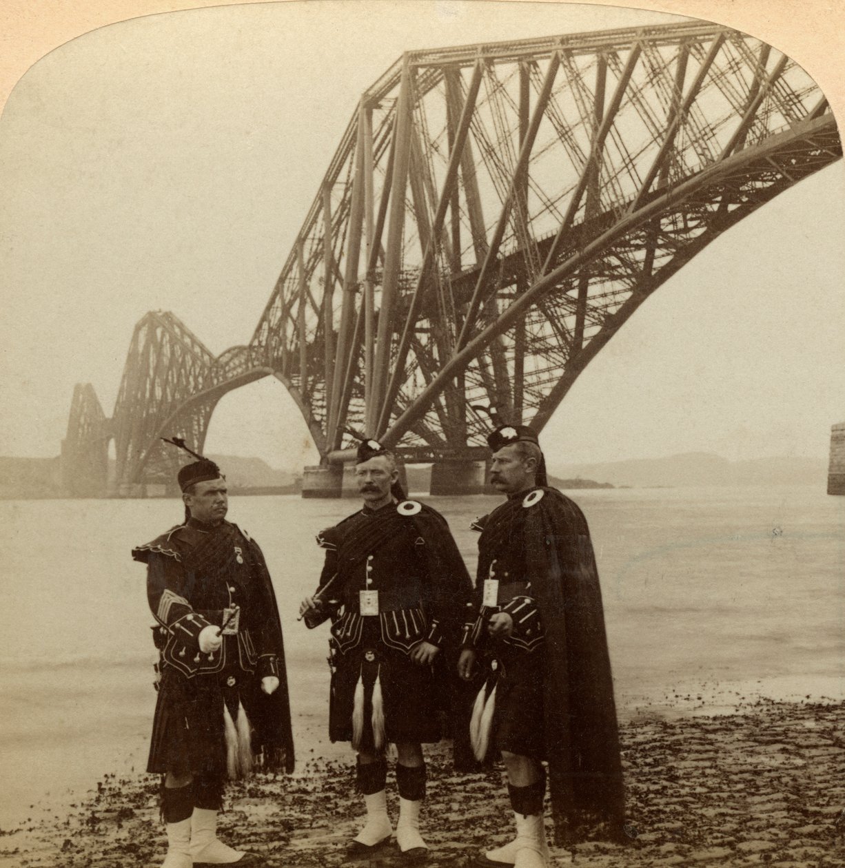 Men in Highland Dress in Front of the Forth Bridge, Scotland by Underwood and Underwood