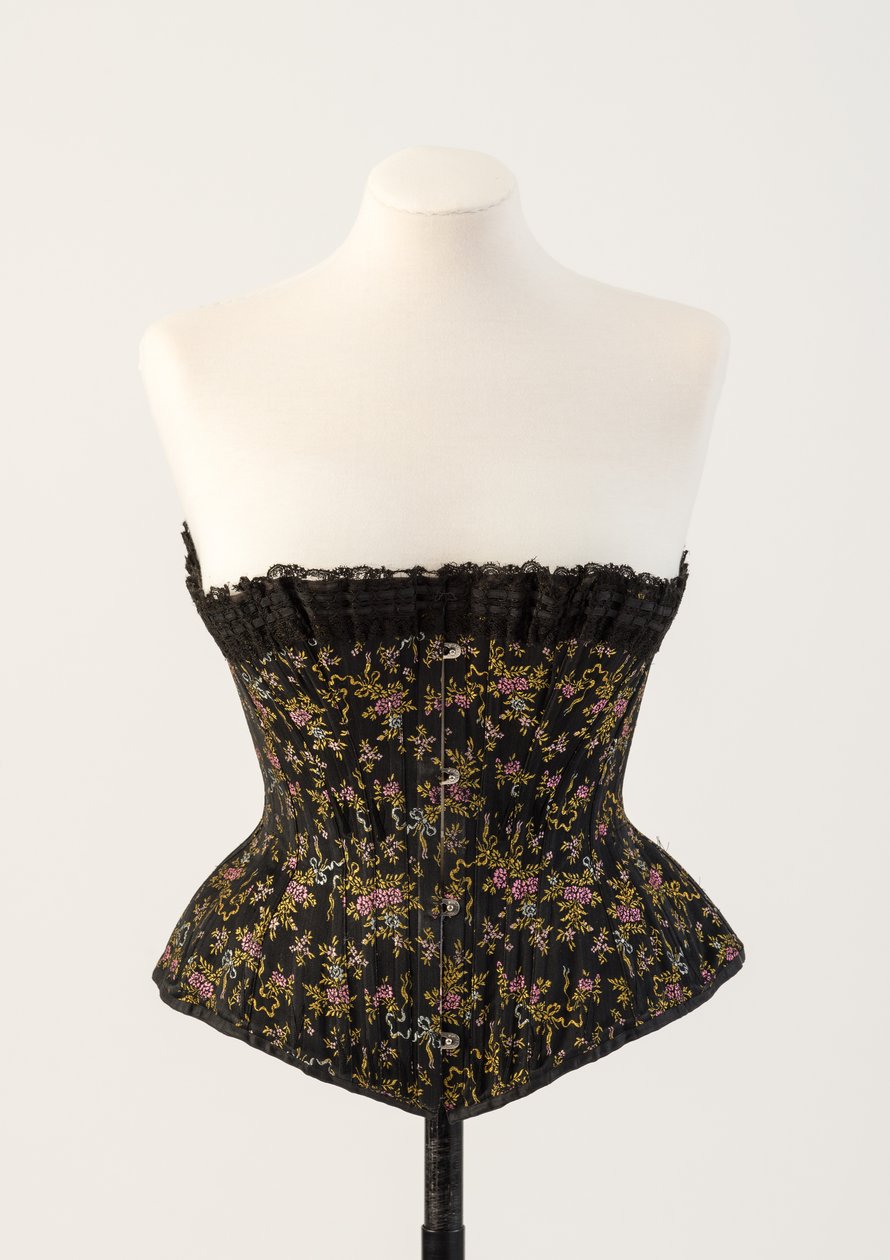 Black woven silk boned corset, with tiny blue and pink flowers, 1890s by Unbekannt Unbekannt